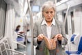 Senior woman discovered theft in subway train Royalty Free Stock Photo