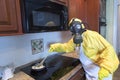 Mature woman in Haz Mat suit cooking Royalty Free Stock Photo