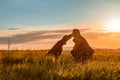 Mature woman and her beautiful hungarian vizsla. Dog love and friendship background. Woman kissing her dog.