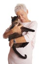 Mature woman holding cat in her arms Royalty Free Stock Photo