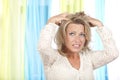 Mature woman with itchy scalp Royalty Free Stock Photo