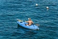 Mature Woman Kayaking in the Blue Sea - Liguria Italy