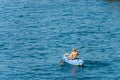 Mature Woman Kayaking in a Blue Sea - Liguria Italy