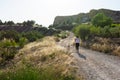 Mature woman with labrador jogging in countryside Royalty Free Stock Photo