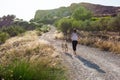 Mature woman with labrador jogging in countryside Royalty Free Stock Photo