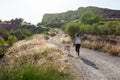 Mature woman with labrador jogging in countryside Royalty Free Stock Photo