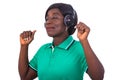 Mature woman listening to music with her wireless headphones smiling