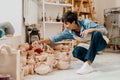 Woman looking at pottery handcrafts while sitting at the workshop Royalty Free Stock Photo