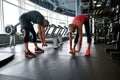 Mature woman and man learning to perform body friendly warm up routines Royalty Free Stock Photo