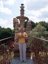 Mature woman meditation near a ceramic slavic statue, pagan culture. Active lifestyle, spirituality and mental healthy