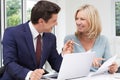 Mature Woman Meeting With Financial Advisor At Home Royalty Free Stock Photo