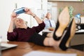 Mature woman office worker using smartphone during break Royalty Free Stock Photo