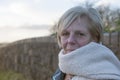 Mature woman outdoors in winter wearing a scarf Royalty Free Stock Photo