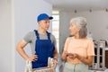 Mature woman pays a fifteen-year-old worker Royalty Free Stock Photo