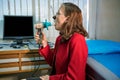 Mature woman performing pulmonary function test and spirometry