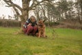 Mature woman with pet Alsatian Royalty Free Stock Photo