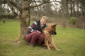 Mature woman with pet Alsatian Royalty Free Stock Photo