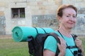 Mature woman pilgrim resting , Way of St James, Camino de Santiago, to Compostela, Galicia, Spain