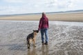 Mature woman playing with her Alsatian dog Royalty Free Stock Photo