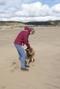 Mature woman playing with her Alsatian dog Royalty Free Stock Photo