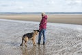 Mature woman playing with her Alsatian dog Royalty Free Stock Photo