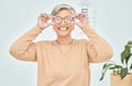 Mature woman, portrait and glasses for vision eye, test and optometry in clinic wellness, choice and prescription frames Royalty Free Stock Photo