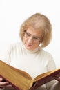 Mature woman reading old book/Bible Royalty Free Stock Photo