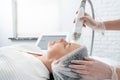 Mature woman receiving laser treatment in cosmetology clinic Royalty Free Stock Photo