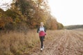 Mature Woman Running Around Autumn Field Royalty Free Stock Photo