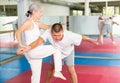 Woman self defense training gym learning to do painful grip Royalty Free Stock Photo