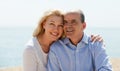 Mature woman and senior at sea beach on vacation smiling Royalty Free Stock Photo