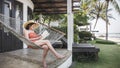 Mature woman sitting on a hammock Royalty Free Stock Photo