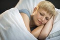 Mature Woman Sleeping In Bed