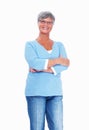 Mature woman smiling with hands folded. Casually dressed mature woman smiling over white background with hands folded.