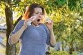 Mature woman sneezing in handkerchief, allergy to pollen, colds