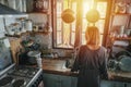 Mature woman standing next to a window in an old narrow cluttered kitchen