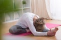 Mature woman stretching her body Royalty Free Stock Photo