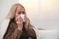 Mature woman suffering from cold. Dangerous virus