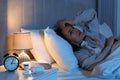 Mature woman suffering from insomnia in bed at night Royalty Free Stock Photo
