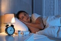 Mature woman suffering from insomnia in bed Royalty Free Stock Photo