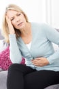 Mature Woman Suffering From Stomach Pain And Headache Royalty Free Stock Photo