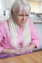 Mature Woman Suffering From Stomach Pain At Home Royalty Free Stock Photo