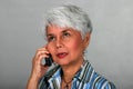 Mature woman using a cell phone Royalty Free Stock Photo