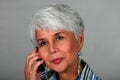 Mature woman using a cell phone Royalty Free Stock Photo