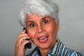 Mature woman using a cell phone Royalty Free Stock Photo