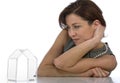 Mature woman watching transparent little house Royalty Free Stock Photo