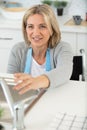 mature woman in wheelchair cooking at home Royalty Free Stock Photo