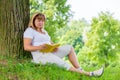 Mature woman of 50 years old reading a book Royalty Free Stock Photo