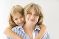 Mature woman embrace with young girl Royalty Free Stock Photo