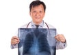 Matured Asian medical doctor posing with lungs X-ray negative film